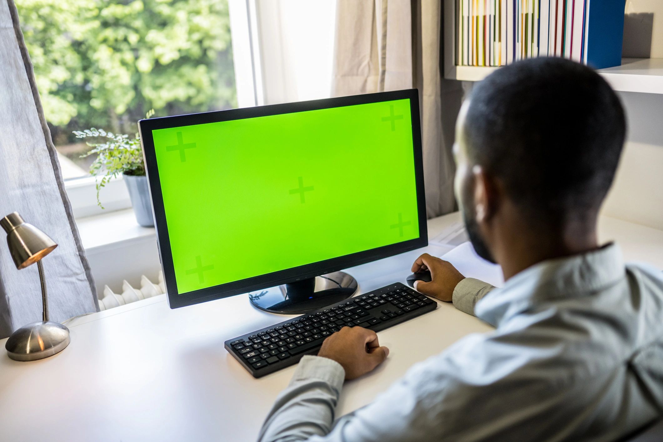 Engineer reviewing a 3D part design on a computer screen