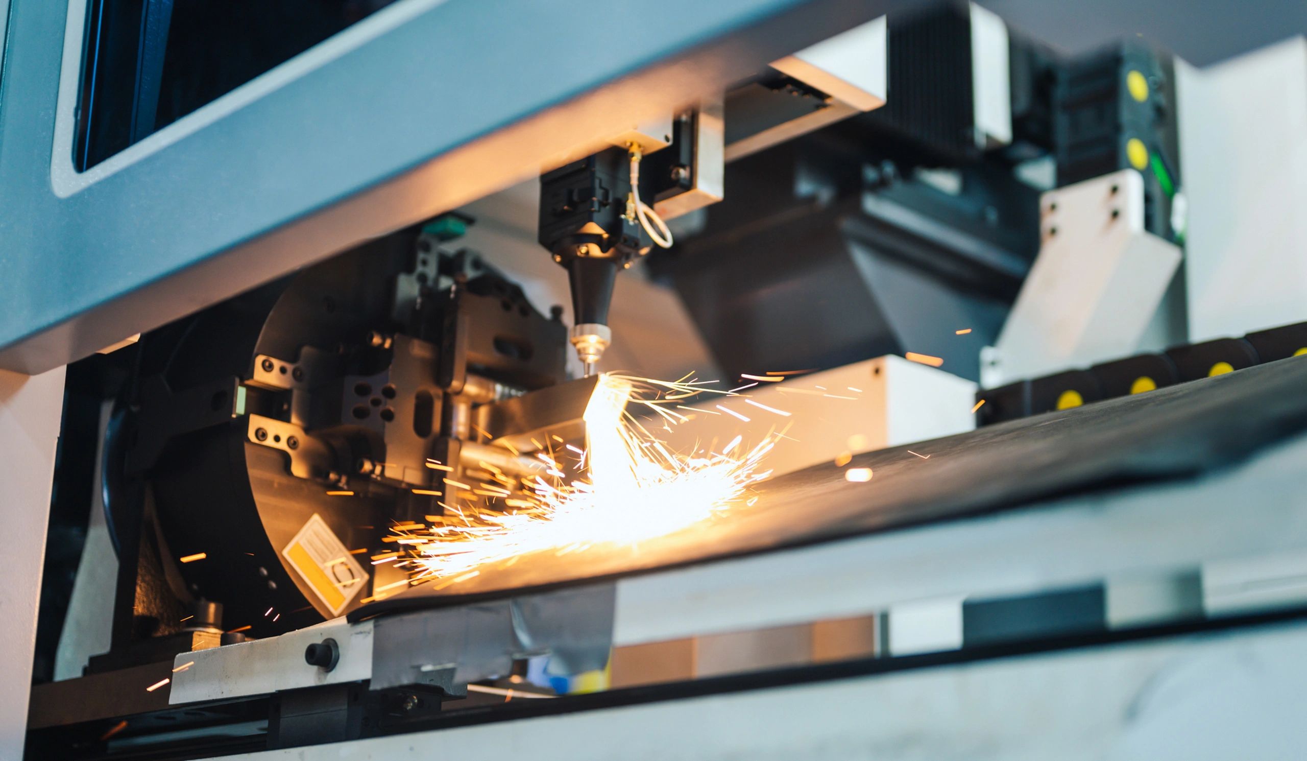 CNC machining center cutting a precision metal component